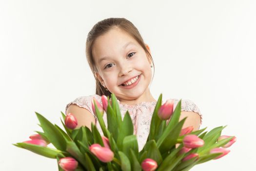 the beautiful girl gives a bouquet of tulips