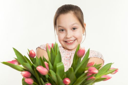 the beautiful girl gives a bouquet of tulips