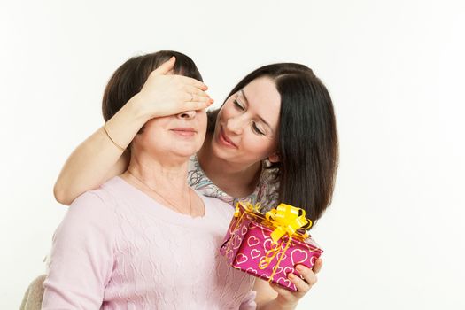 the woman gives to mother a gift