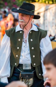 SALIR, PORTUGAL - 11 JULY: People, street performers, artists, mood and color on the Salir do Tempo medieval festival held on Salir, Portugal in July 2015.