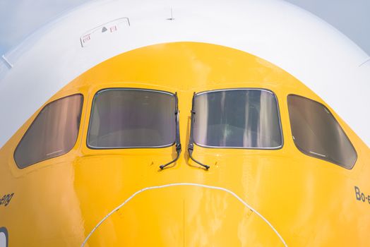 Singapore - February 16, 2016: Front detail of a Boeing 787-9 Dreamliner in the livery of no frills Singapore airline Scoot during Singapore Airshow at Changi Exhibition Centre in Singapore.