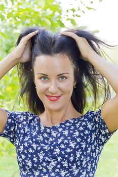 Photo of European woman playing with black hair