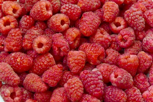 Photo of the background fresh red raspberry