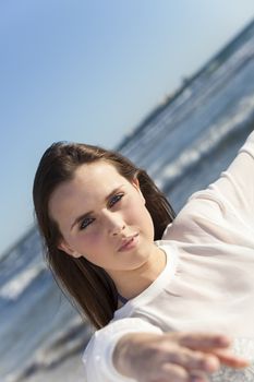 woman pointing at the beach