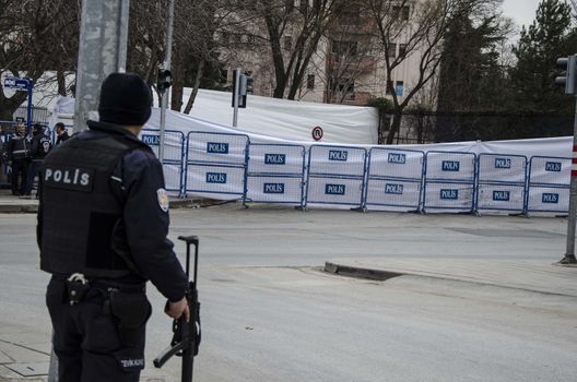 TURKEY, Ankara: A police officer stands at the scene of an explosion in Ankara, Turkey on February 19, 2016, which killed 28 people.