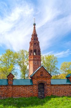 Repairing church of red brick in summer sunny day