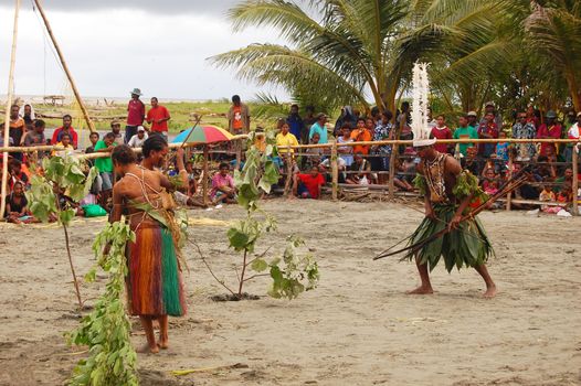 Traditional tribal dance at mask festival. 7th Gulf Mask Festival, Toare Village, Gulf Province, Papua New Guinea on June 19, 2011