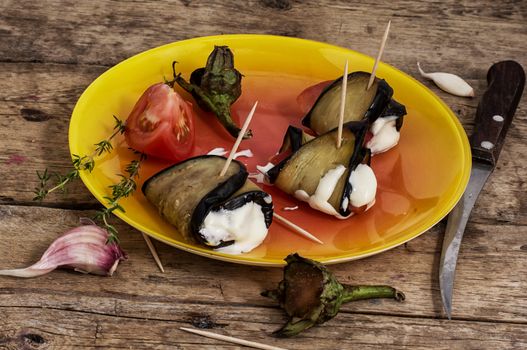 Spring salad with fresh vegetables and roasted eggplants