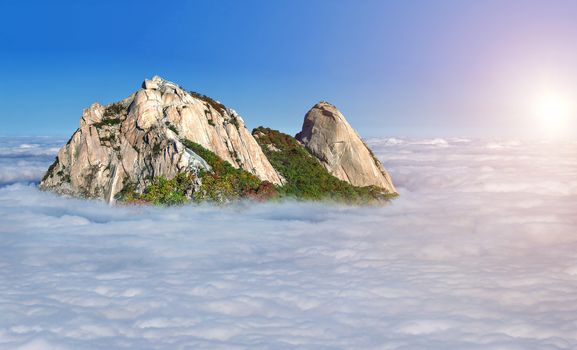 Bukhansan mountains is covered by morning fog in Seoul,Korea
