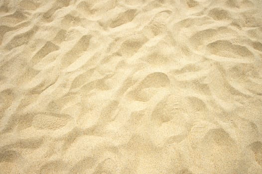 Footmarks on sand background