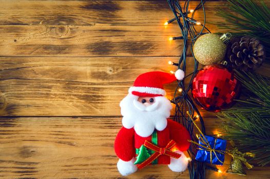 Christmas background with christmas gift,red balls, pine cones on Wooden Background. Christmas vintage style