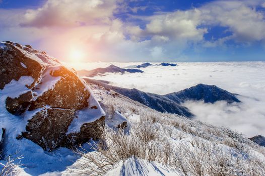 Seoraksan mountains is covered by morning fog and sunlight in winter, Korea.