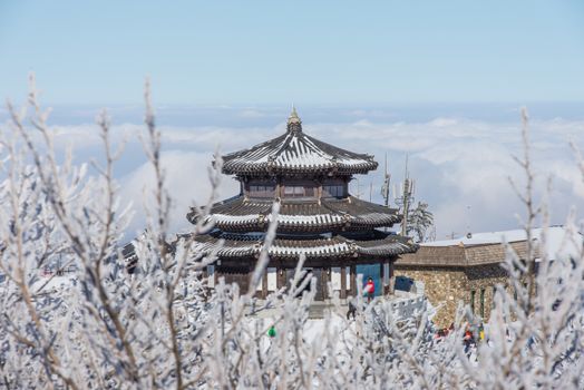 DEOGYUSAN,KOREA - JANUARY 23: Tourists taking photos of the beautiful scenery and skiing around Deogyusan,South Korea on January 23, 2015.