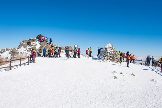 DEOGYUSAN,KOREA - JANUARY 23: Tourists taking photos of the beautiful scenery around Deogyusan,South Korea on January 23, 2015.