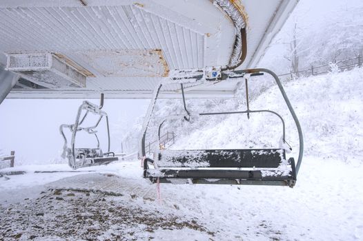 Ski chair lift is covered by snow in winter, Korea.
