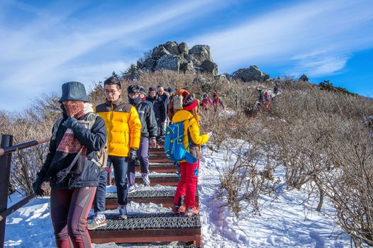 DEOGYUSAN,KOREA - JANUARY 1: Tourists taking photos of the beautiful scenery and skiing around Deogyusan,South Korea on January 1, 2016.