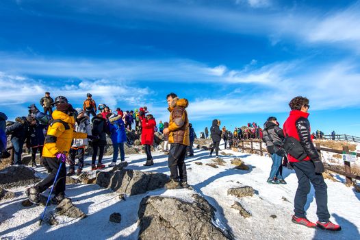 DEOGYUSAN,KOREA - JANUARY 1: Tourists taking photos of the beautiful scenery and skiing around Deogyusan,South Korea on January 1, 2016.