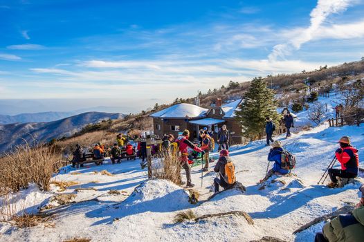 DEOGYUSAN,KOREA - JANUARY 1: Tourists taking photos of the beautiful scenery and skiing around Deogyusan,South Korea on January 1, 2016.