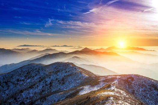 Winter landscape with sunset and foggy in Deogyusan mountains, South Korea.