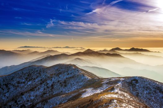 Winter landscape with sunset and foggy in Deogyusan mountains, South Korea.