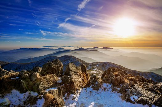 Winter landscape with sunset and foggy in Deogyusan mountains, South Korea.