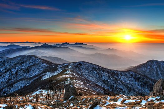 Winter landscape with sunset and foggy in Deogyusan mountains, South Korea.