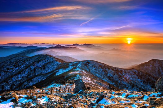 Winter landscape with sunset and foggy in Deogyusan mountains, South Korea.