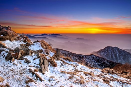 Winter landscape with sunset and foggy in Deogyusan mountains, South Korea.