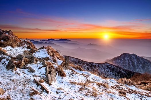 Winter landscape with sunset and foggy in Deogyusan mountains, South Korea.