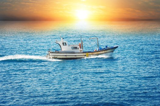 fishing boat in sea at sunset