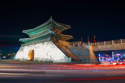 Hwaseong fortress with car light at night in Suwon,Korea