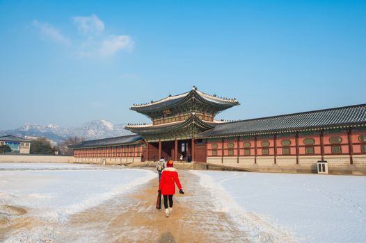 SEOUL, SOUTH KOREA - JANUARY 19: Tourists taking photos of the beautiful scenery around Gyeongbokgung Palace on January 19, 2015 in Seoul, South Korea.