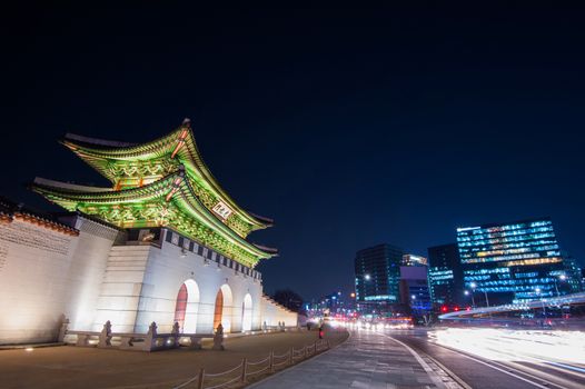 Geyongbokgung Palace and car light at night in Seoul, South Korea.