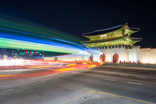 Geyongbokgung Palace and car light at night in Seoul, South Korea.