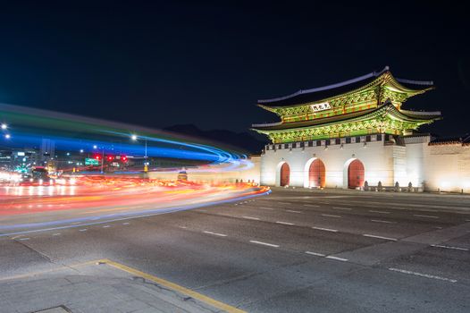 Geyongbokgung Palace and car light at night in Seoul, South Korea.