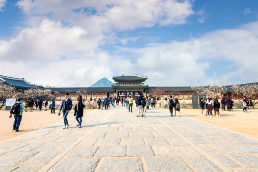 SEOUL, SOUTH KOREA - APRIL 9: Tourists taking photos of the beautiful scenery around Gyeongbokgung Palace on April 9, 2015 in Seoul, South Korea.