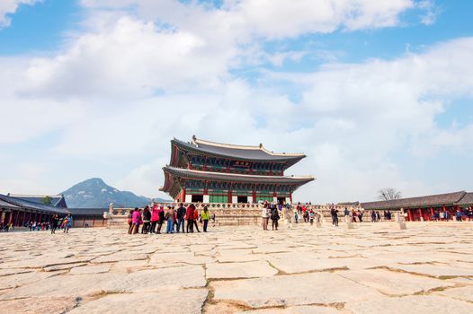 SEOUL, SOUTH KOREA - APRIL 9: Tourists taking photos of the beautiful scenery around Gyeongbokgung Palace on April 9, 2015 in Seoul, South Korea.