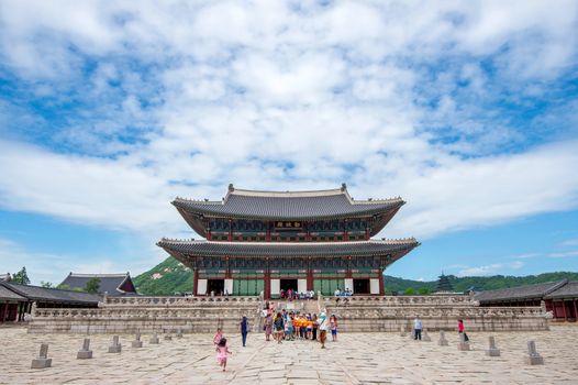 SEOUL, SOUTH KOREA - JULY 17: Tourists taking photos of the beautiful scenery around Gyeongbokgung Palace on July 17, 2015 in Seoul, South Korea.