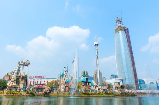 SEOUL, KOREA - APRIL 9, 2015: Lotte World amusement park and cherry blossom of Spring, a major tourist attraction in Seoul, South Korea on April 9, 2015