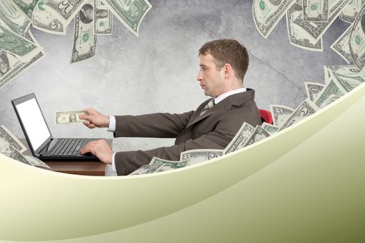 Businessman giving dollar to laptop on grey wall background