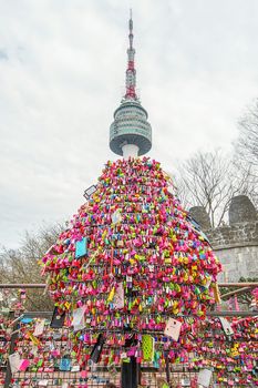 SEOUL - MARCH 28 : Love padlocks at N Seoul Tower or Locks of love is a custom in some cultures which symbolize their love will be locked forever at Seoul Tower on March 28,2015 in seoul,Korea.