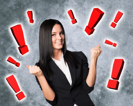 Smiling businesswoman with exclamation signs around, business concept