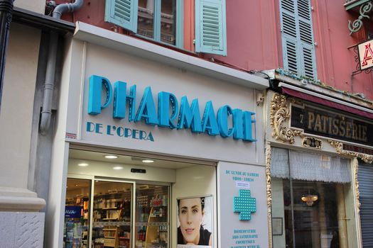 Nice, France - February 15 2016: Facade of a French Pharmacy in Nice. French Pharmacy Neon Blue Sign