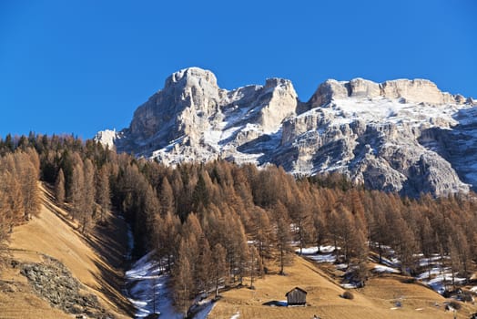 Mountains and hill landscape in autumn season with blue sky in background, Alta Badia - Dolomiti, Trentino-Alto Adige