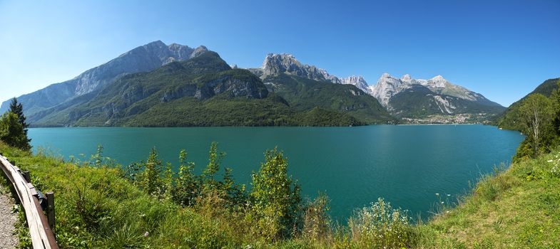 Landscape of Molveno lake and Dolomiti di Brenta group in summer season, Trentino - Italy