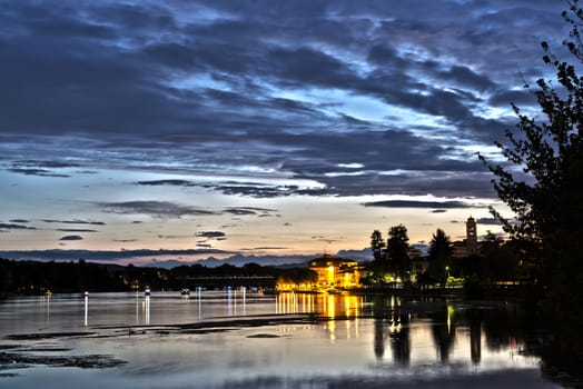 Sunset on the river Ticino in the district of Sesto Calende (Varese) in a summer cloudy afternoon, Italy