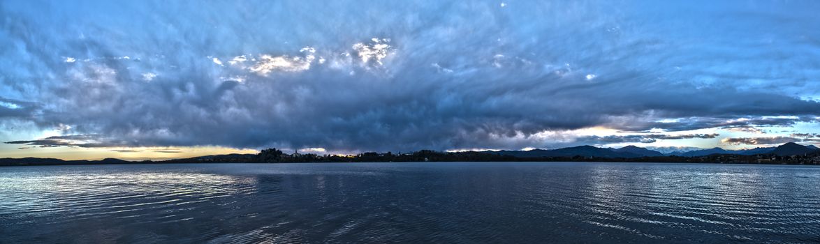 Landscape on the Varese lake with dramatic sky at the sunset, Voltorre di Gavirate - Lombardy, Italy