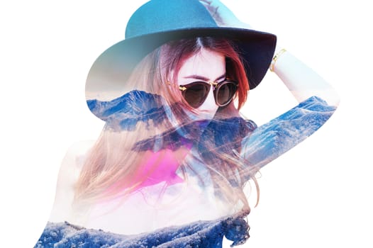 Double exposure portrait of beautiful girl combined with photograph of snowy mountain