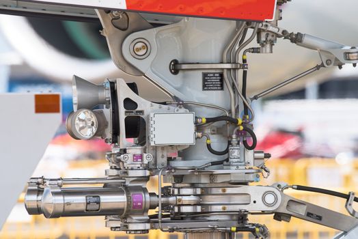 Singapore - February 16, 2016: Side view of the nose landing gear of an Airbus A350-900 XWB at Singapore Airshow at Changi Exhibition Centre in Singapore.