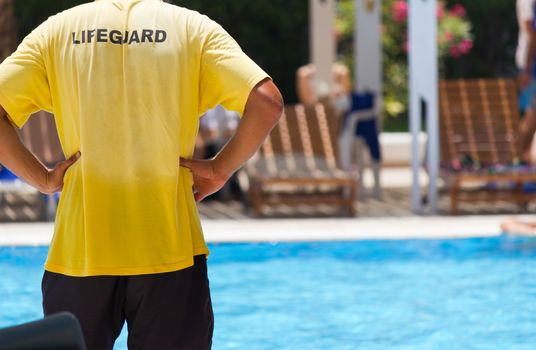 Lifeguard keeping watch at pool